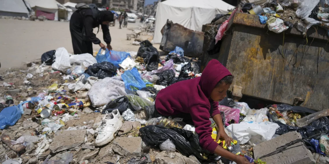 Gazan family digs through trash for food as desperation grows