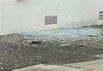 Smashed window and blood on door as forensics called to residential street